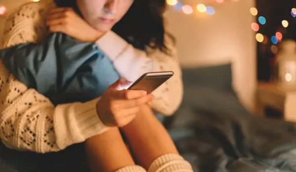 teenager looking at phone