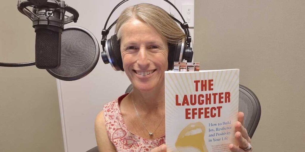 Ros Ben Moshe holding her book The Laughter Effect