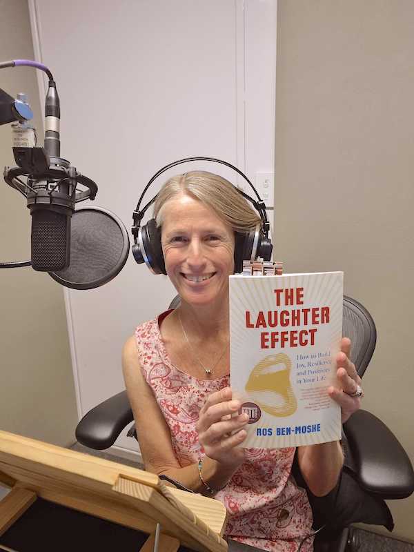 Ros Ben Moshe holding her book The Laughter Effect
